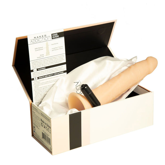 A beige realistic-looking 9 inch silicone dildo in packaging with user guide and vibrating bullet