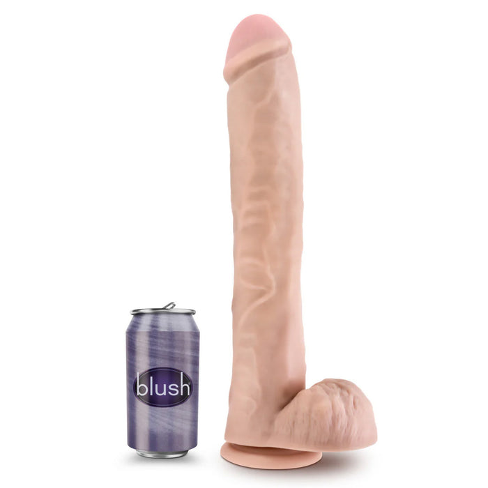 Large realistic beige dildo next to a soda can on a white background