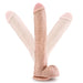 Large realistic flexible beige dildo on a white background