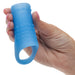 Hand holding a textured blue silicone penis sleeve on a white background