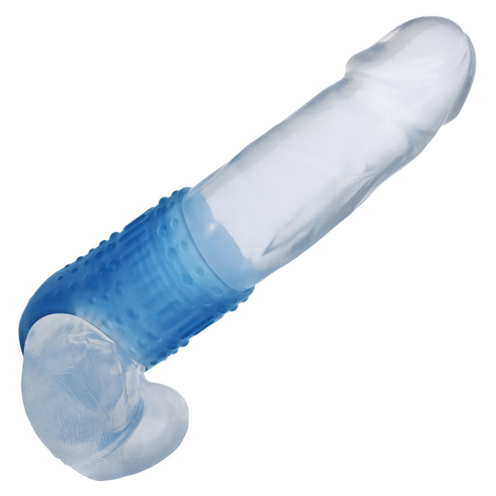 Blue silicone penis sleeve worn over a clear dildo on a white background
