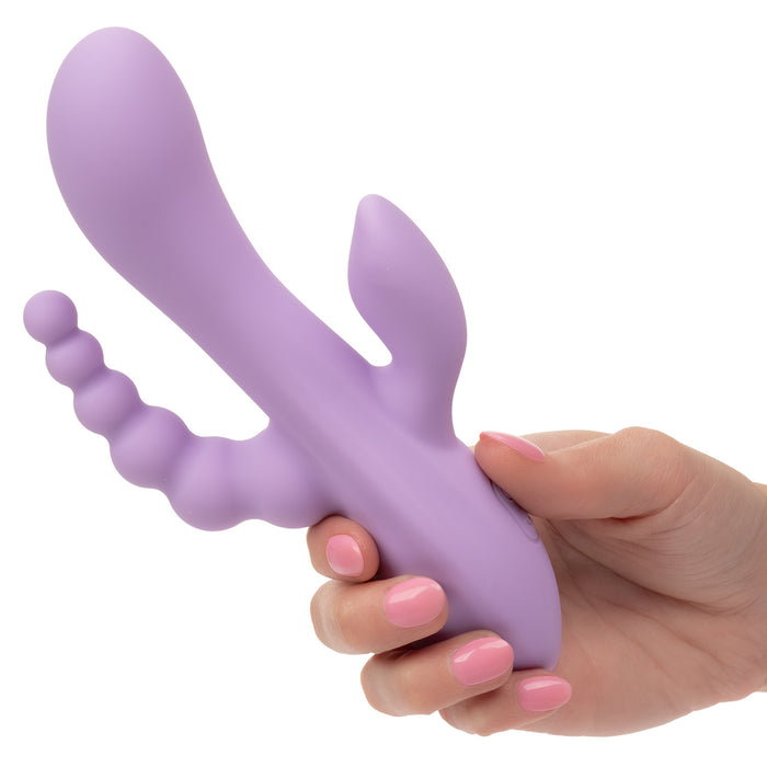 Hand holding a purple silicone triple penetration vibrator