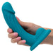 CalExotics SE-4299-15-3 G-Ride Long Haul vibrating turquoise dildo being held in hand