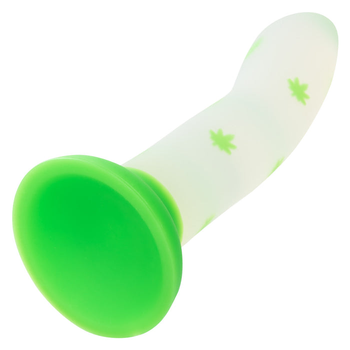 White silicone dildo with green leaf pattern and green suction cup base on a white background