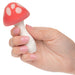 Hand holding Muff Shroom red and white mushroom-shaped vibrator