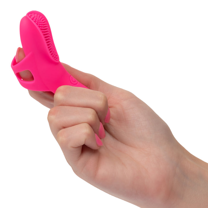 Hand holding a rechargeable hot pink silicone finger vibrator with nubby textured surface