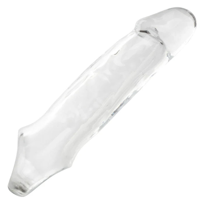 Side view of a clear penis sleeve with scrotum strap on a white background