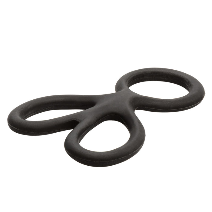 Black silicone ball spreader on a white background