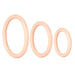 Three beige silicone rings of different sizes on a white background