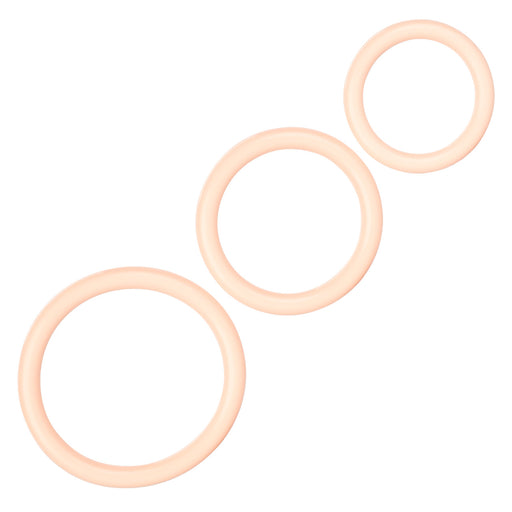 Three beige rubber rings on a white background