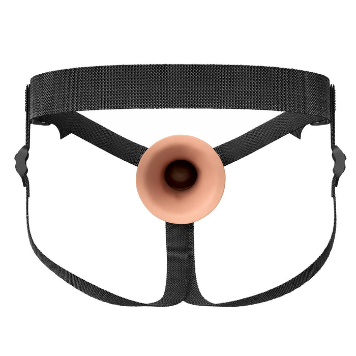 Rear view of beige hollow silicone strap-on with nylon harness on a white background