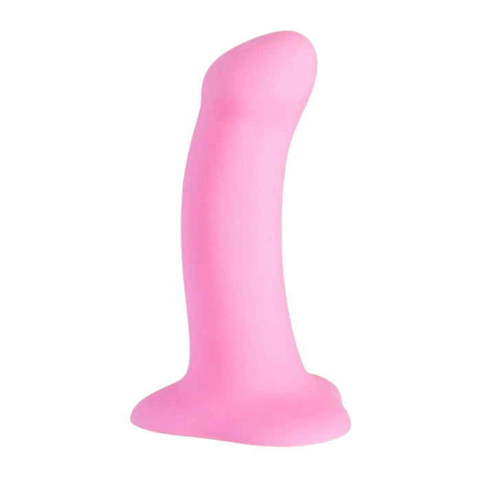 Smooth pink silicone dildo on a white background