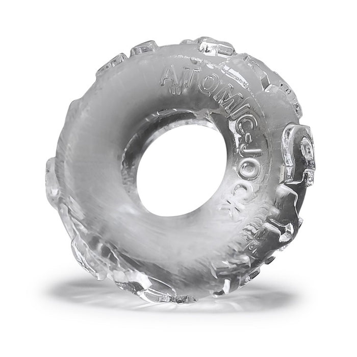 Clear textured jelly cock ring with 'Atomic Jock' lettering on a white background