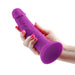 NS Novelties Colours Pleasures 7 Inch Realistic Vibrating Dildo with Suction Cup Base being held in hand