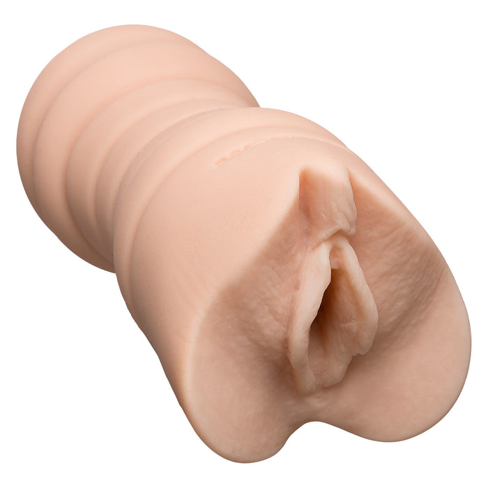 Realistic beige vagina-style male masturbator on a white background