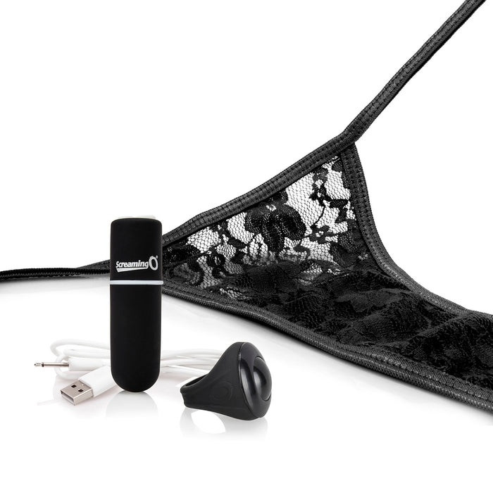 Close up of lace panty with vibrating bullet, ring remote, and charge cable