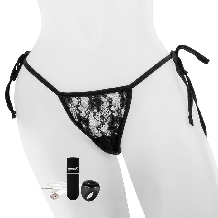 Mannequin wearing black lace panty with vibrating bullet, remote, and charge cable in the foreground