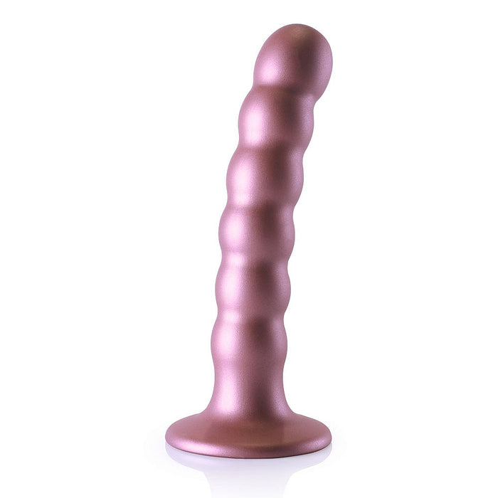 Pink beaded dildo with suction cup base on a white background
