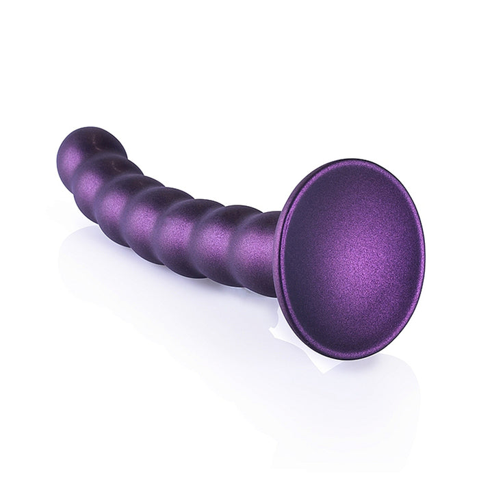 Purple beaded dildo with suction cup base on a white background