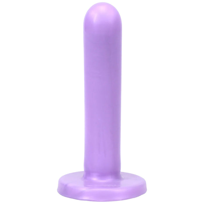 Smooth purple dildo with wide base on a white background